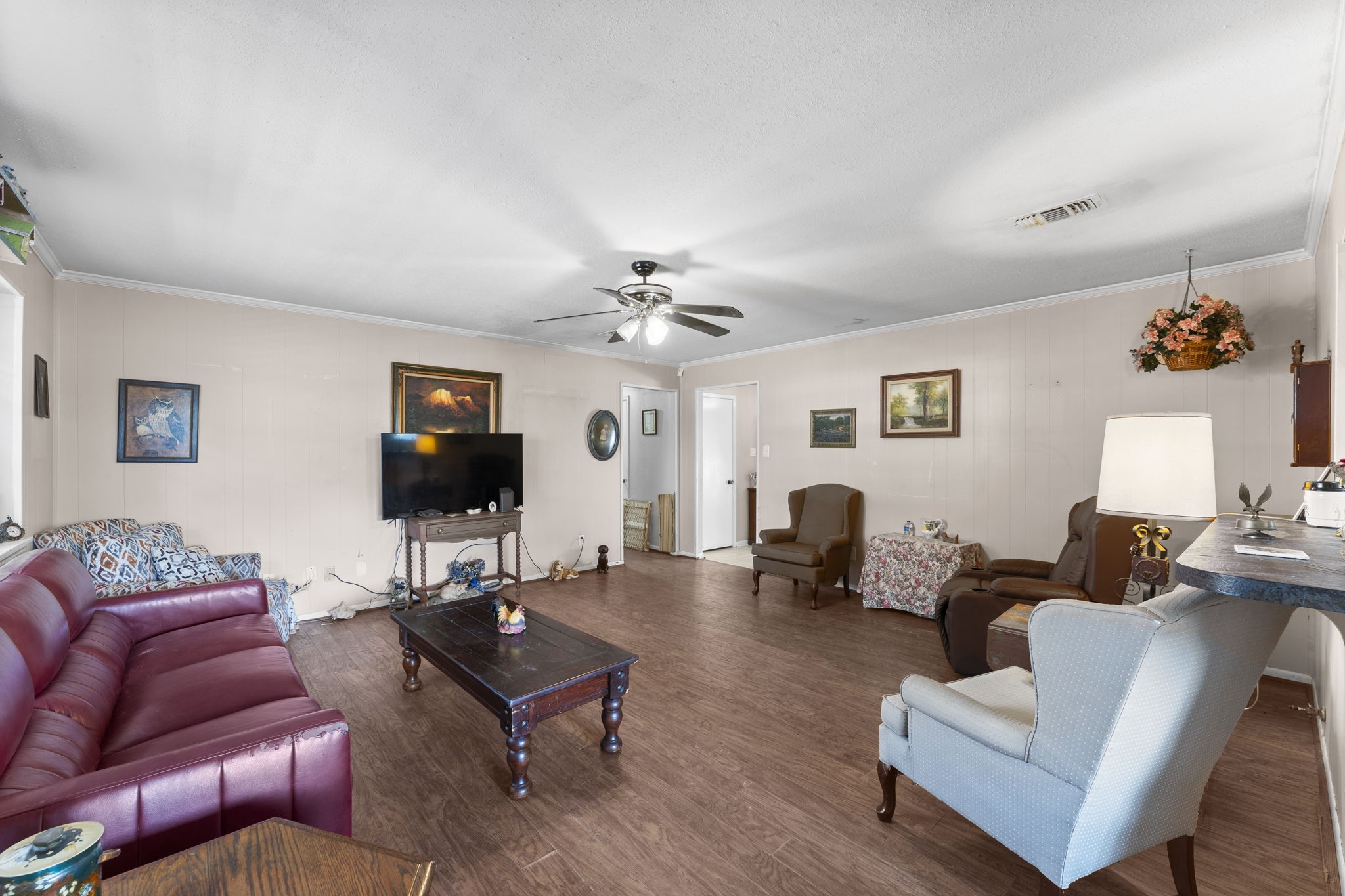 2003 Pinewoods Way Spring, TX 77386 - Photo 22 of 50 a living room with furniture a flat screen tv and a window
