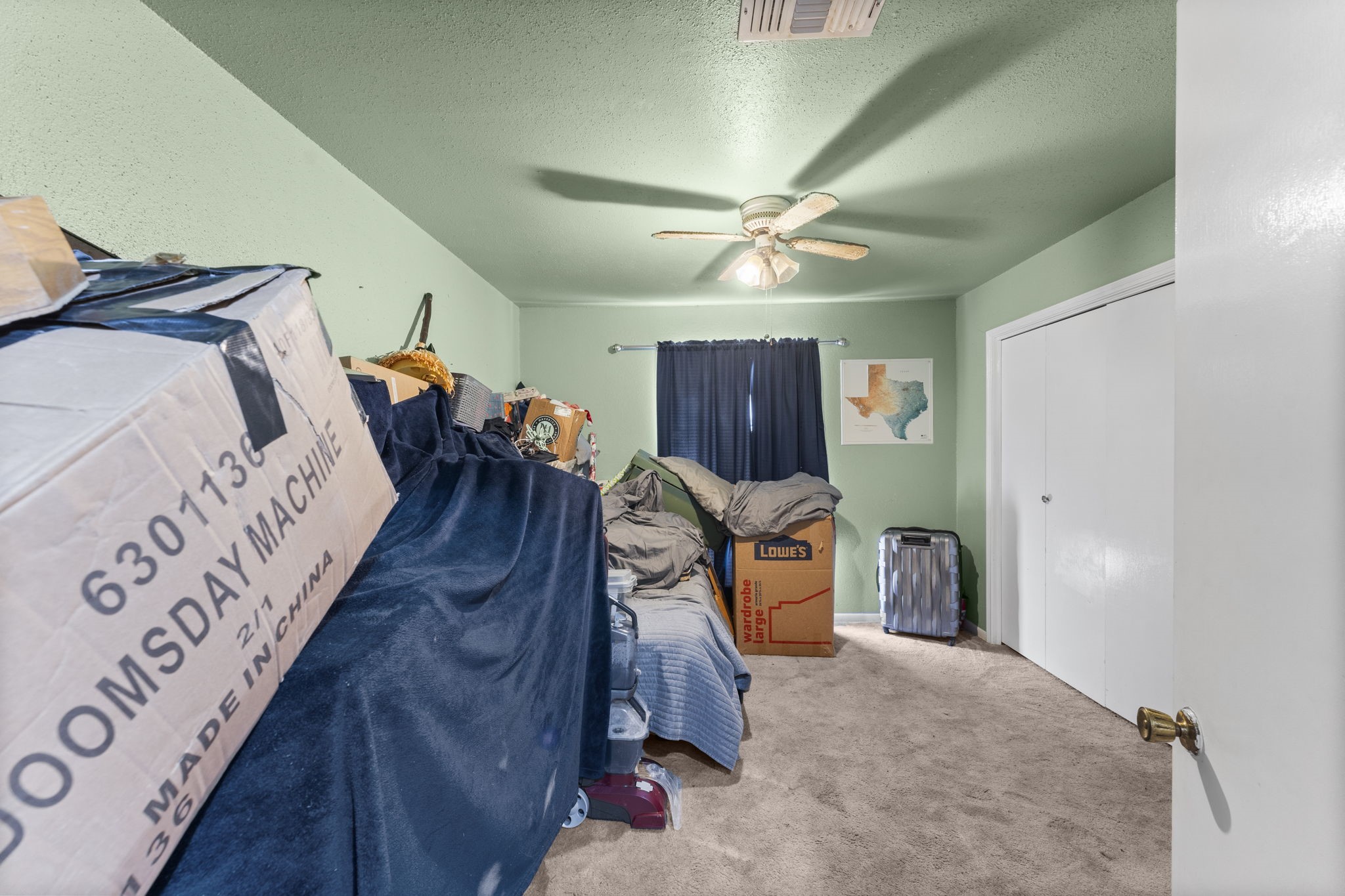 2003 Pinewoods Way Spring, TX 77386 - Photo 28 of 50 a bed room with a bed and a ceiling fan
