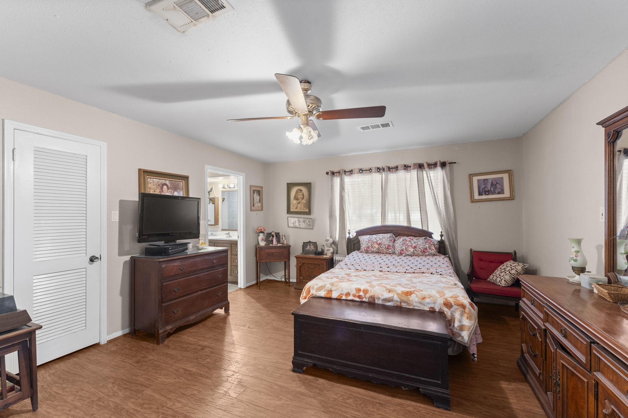2003 Pinewoods Way Spring, TX 77386 - Photo 32 of 50 a bedroom with a bed and a flat screen tv