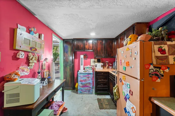 a view of walk in closet with clothes