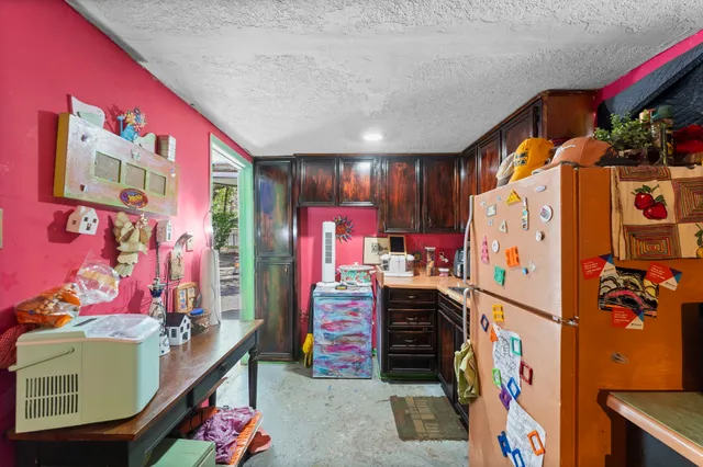 a view of walk in closet with clothes