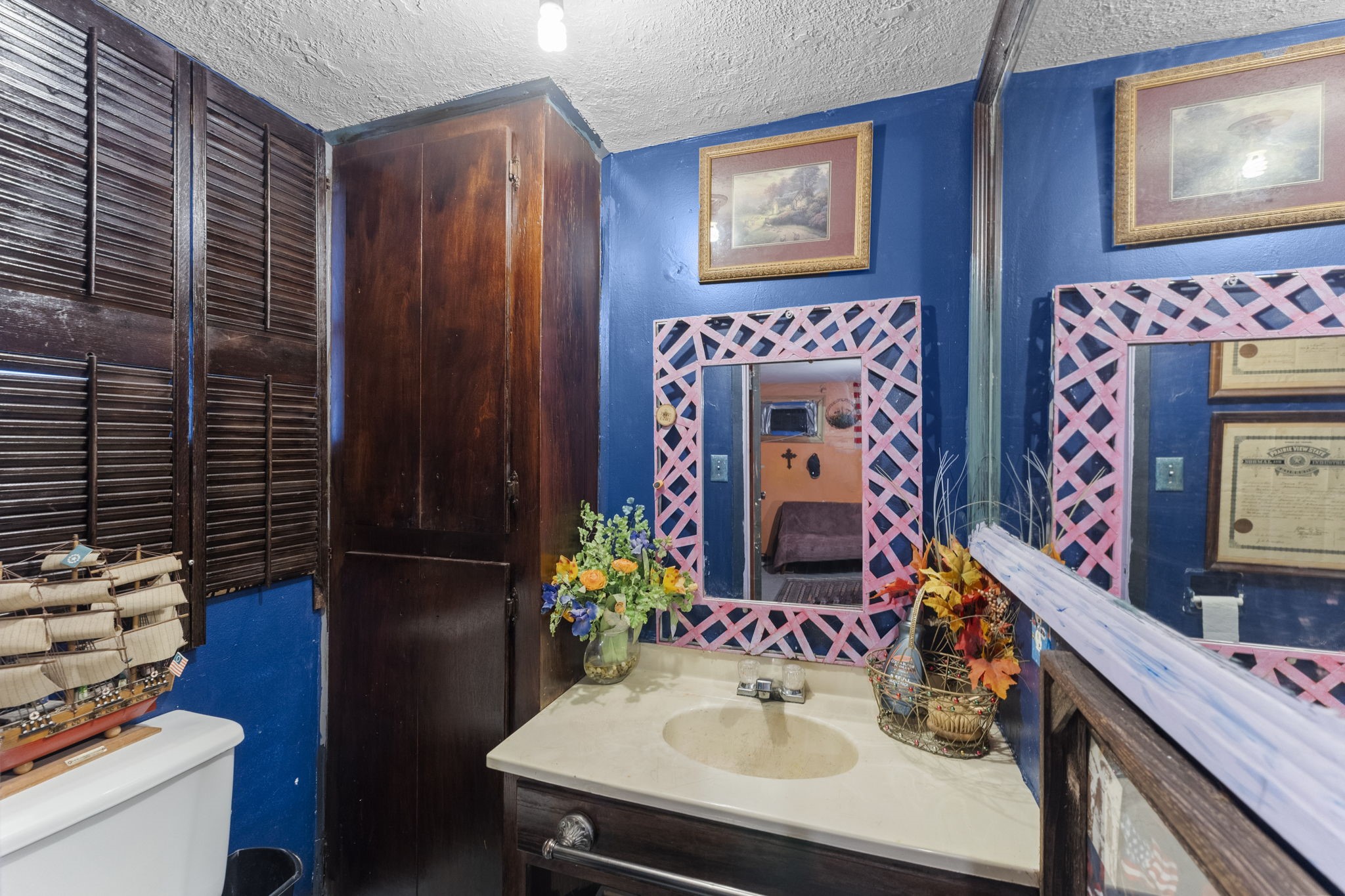 2003 Pinewoods Way Spring, TX 77386 - Photo 41 of 50 a bathroom with a sink vanity and a mirror