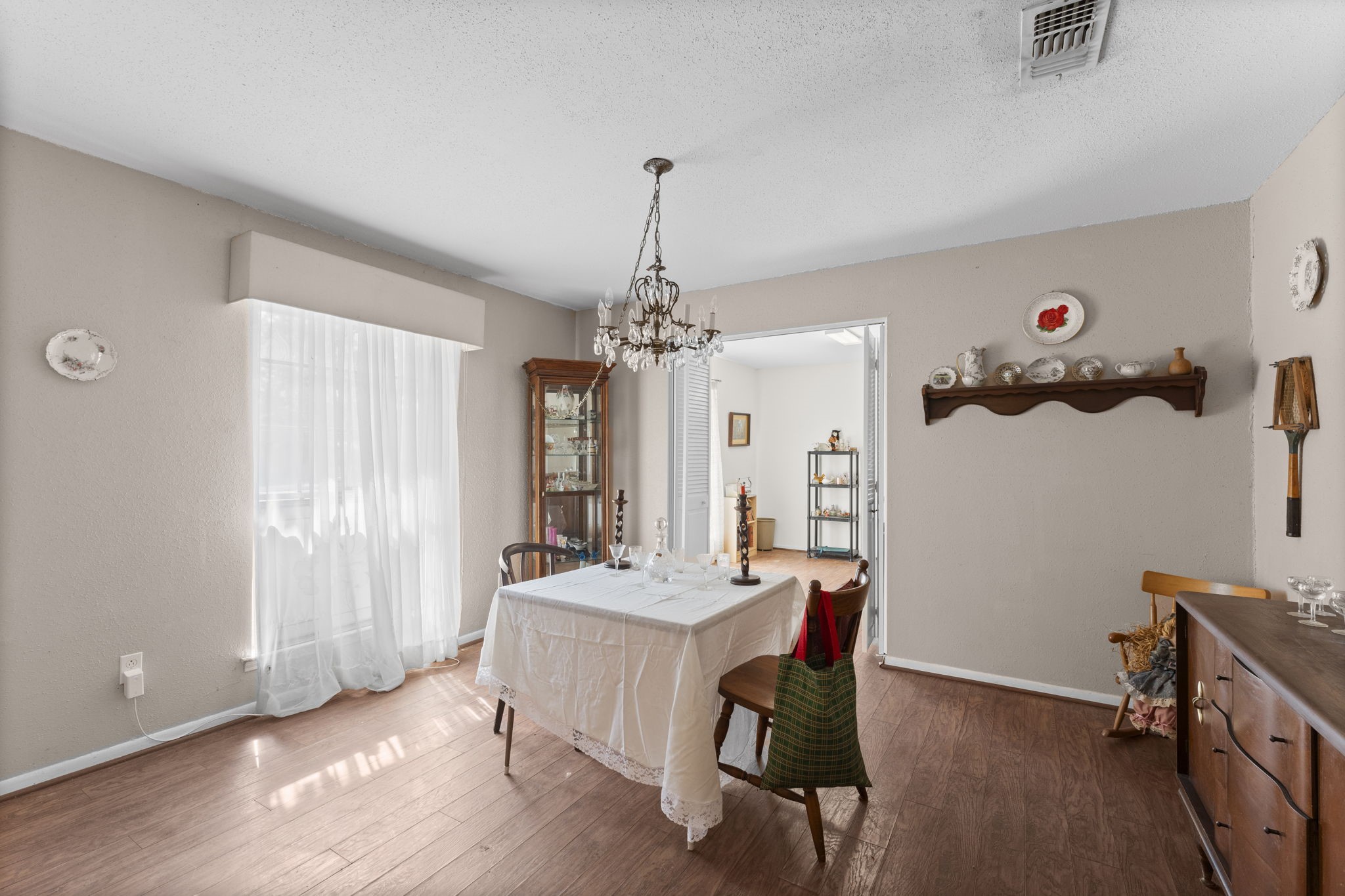 2003 Pinewoods Way Spring, TX 77386 - Photo 10 of 50 a dining room with wooden floor and chandelier