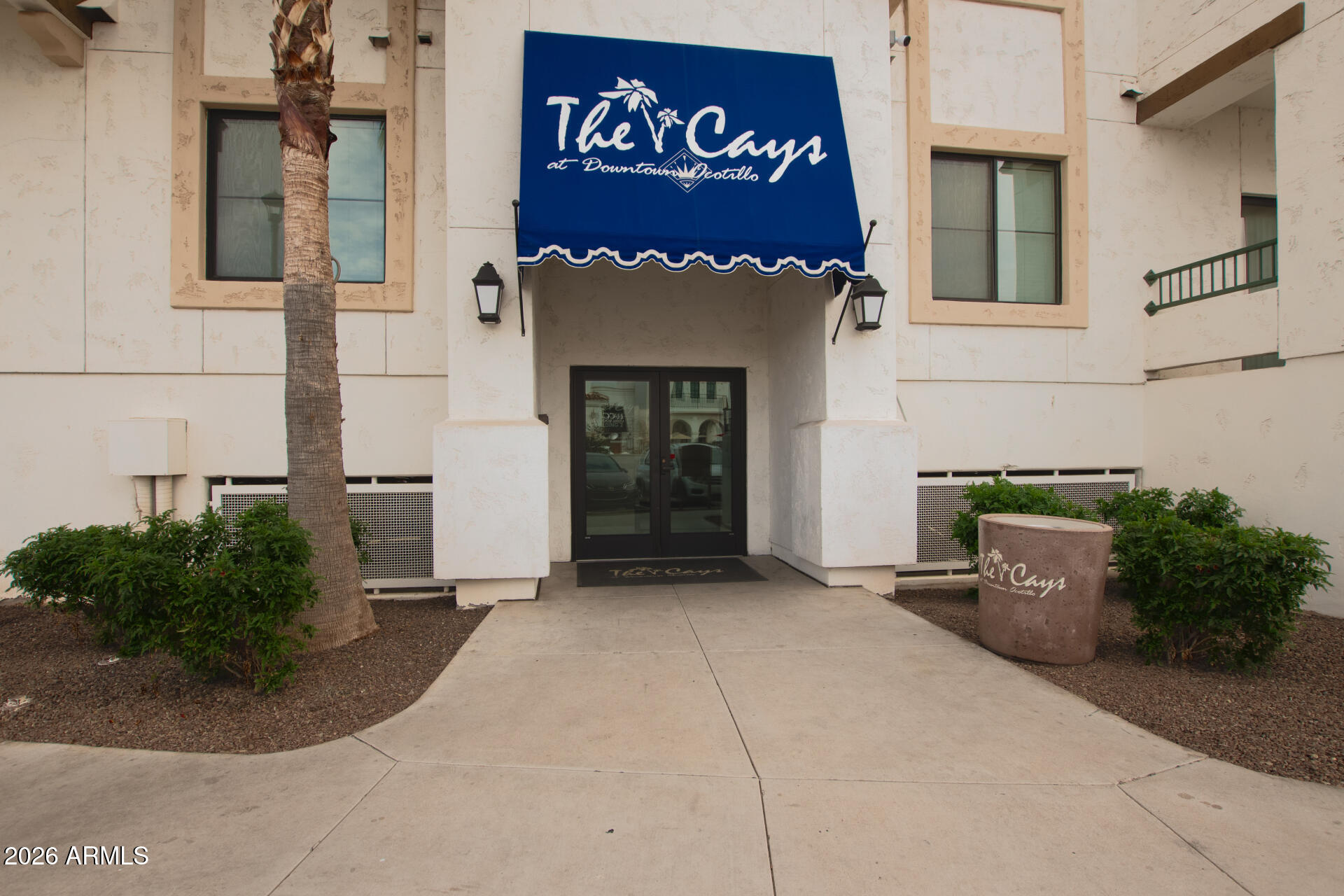 2511 West Queen Creek Road, Unit 239 Chandler, AZ 85248 - Photo 1 of 34 a front view of a building with potted plants