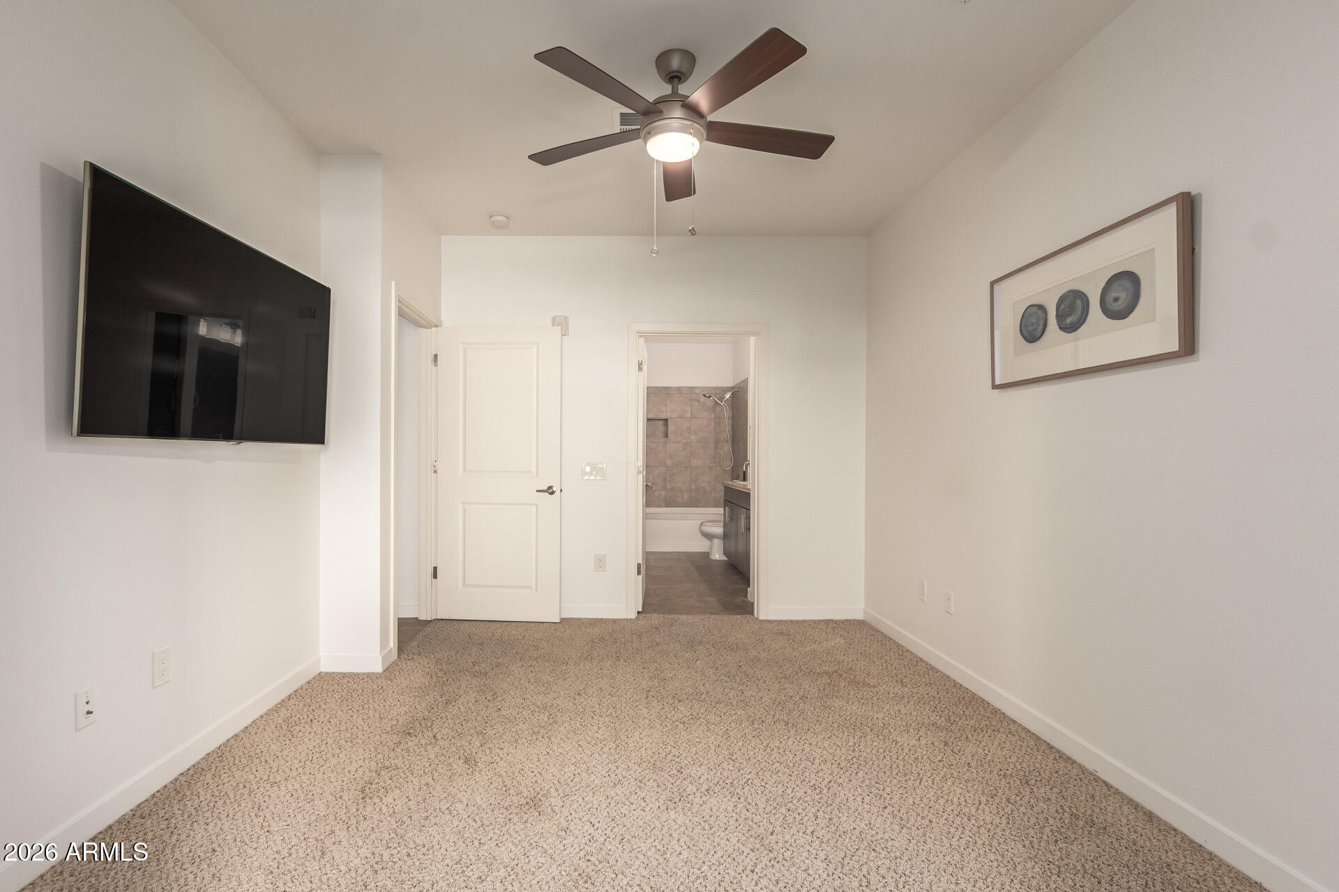2511 West Queen Creek Road, Unit 239 Chandler, AZ 85248 - Photo 12 of 34 a view of a livingroom with a flat screen tv