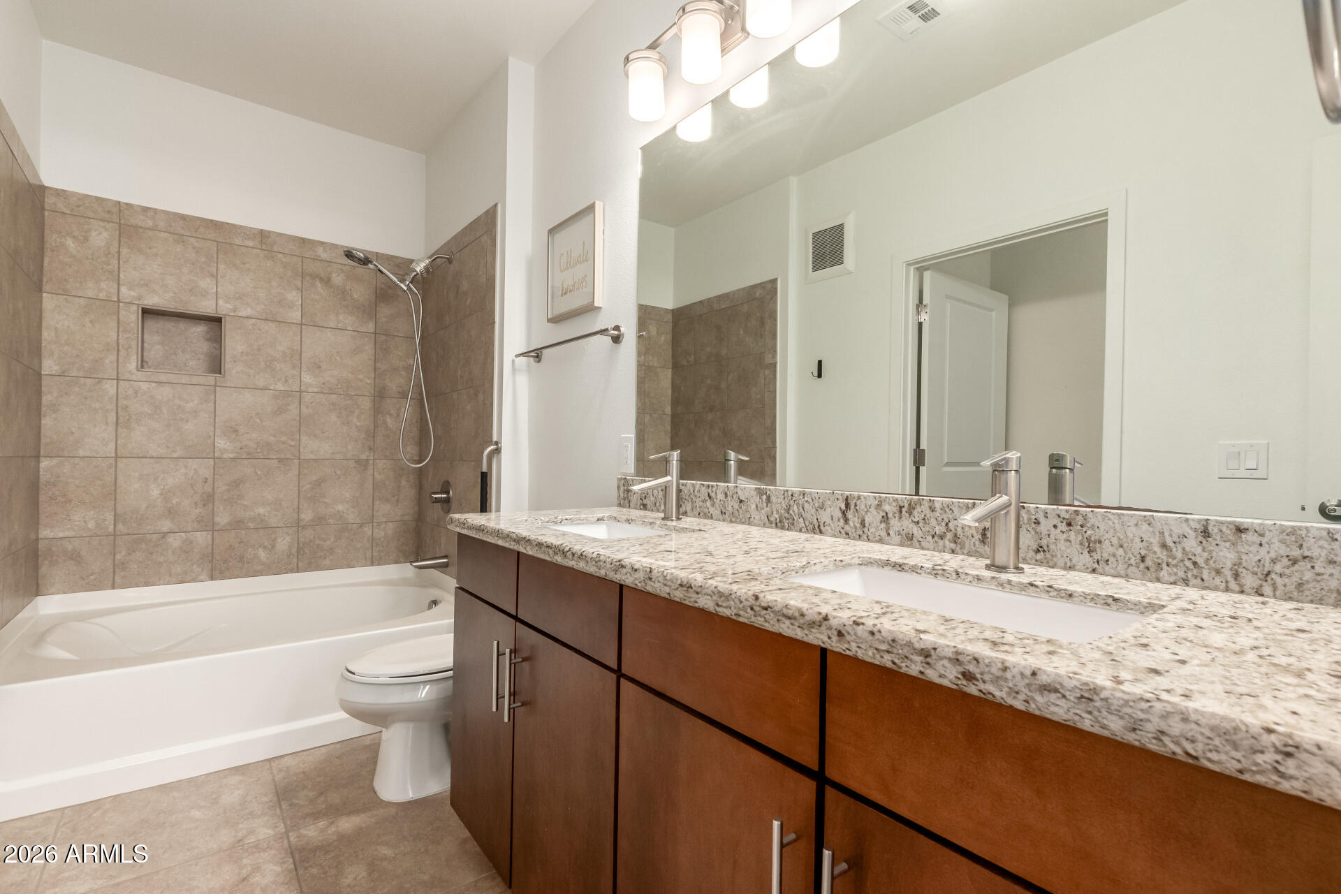 2511 West Queen Creek Road, Unit 239 Chandler, AZ 85248 - Photo 16 of 34 a bathroom with a granite countertop bathtub shower sink vanity and toilet