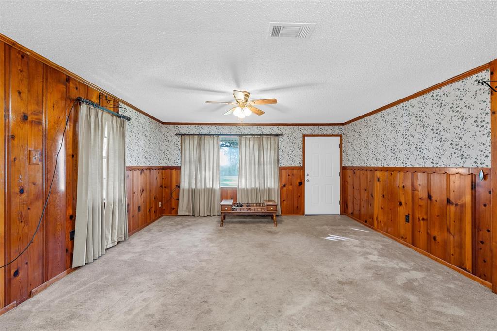 1227 McLennan Crossing Road Woodway, TX 76712 - Photo 12 of 30 an empty room with closet and ceiling fan