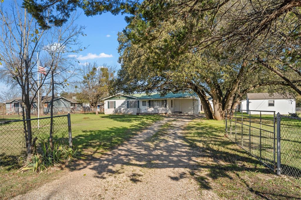 1227 McLennan Crossing Road Woodway, TX 76712 - Photo 4 of 30 a view of a large trees with a big yard and large tree