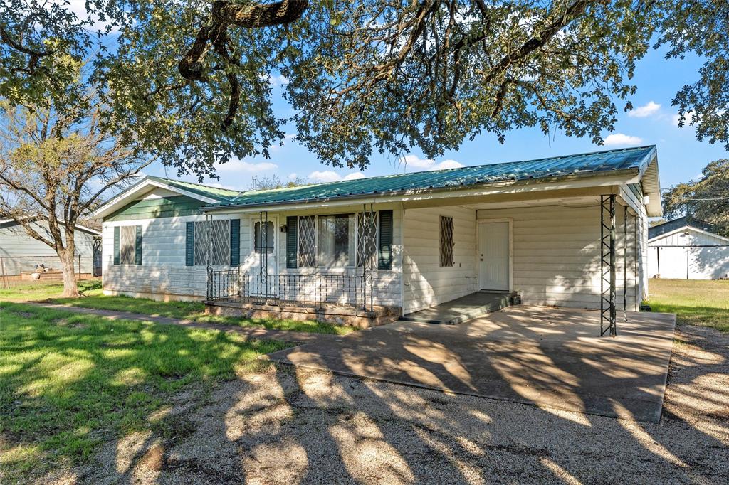 1227 McLennan Crossing Road Woodway, TX 76712 - Photo 5 of 30 a front view of a house with a yard