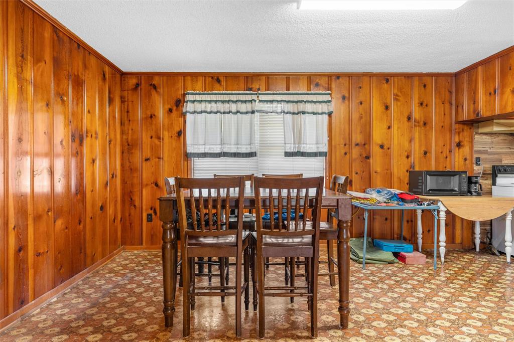 1227 McLennan Crossing Road Woodway, TX 76712 - Photo 10 of 30 a dining room with furniture and a window