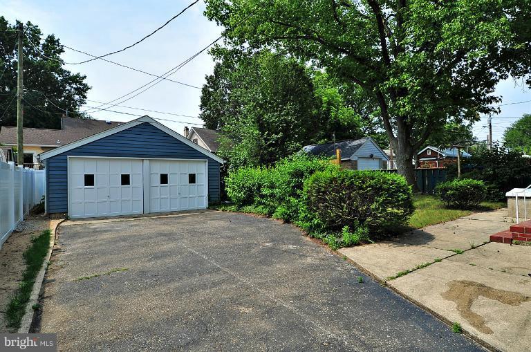 205 Hawthorne Road Linthicum Heights, MD 21090 - Photo 3 of 24 a view of a house with a yard and potted plants