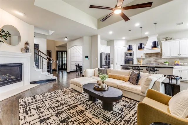 a living room with furniture and a fireplace