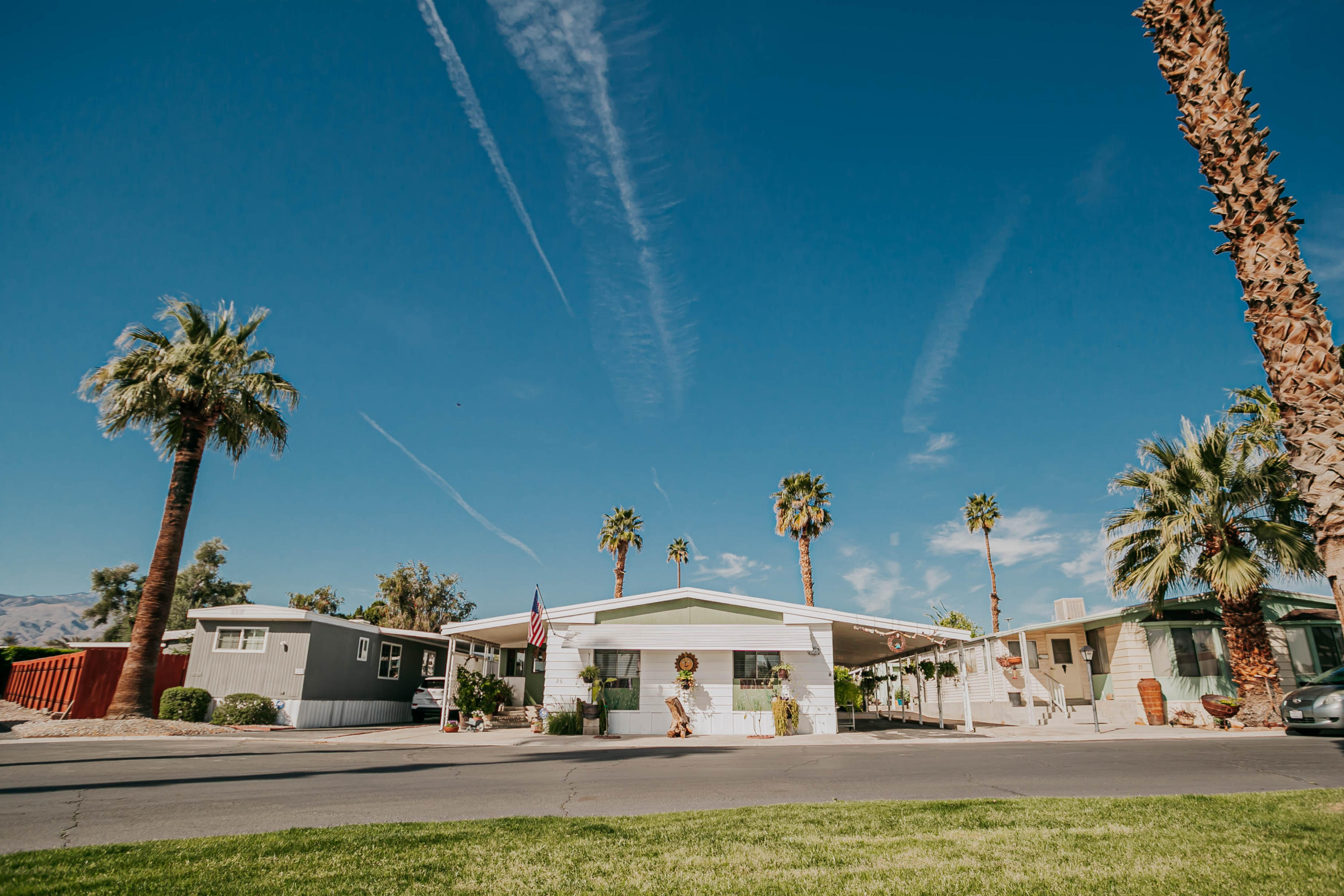 51555 Monroe Street, Unit 26 Indio, CA 92201 - Photo 11 of 54 a view of houses with swimming pool