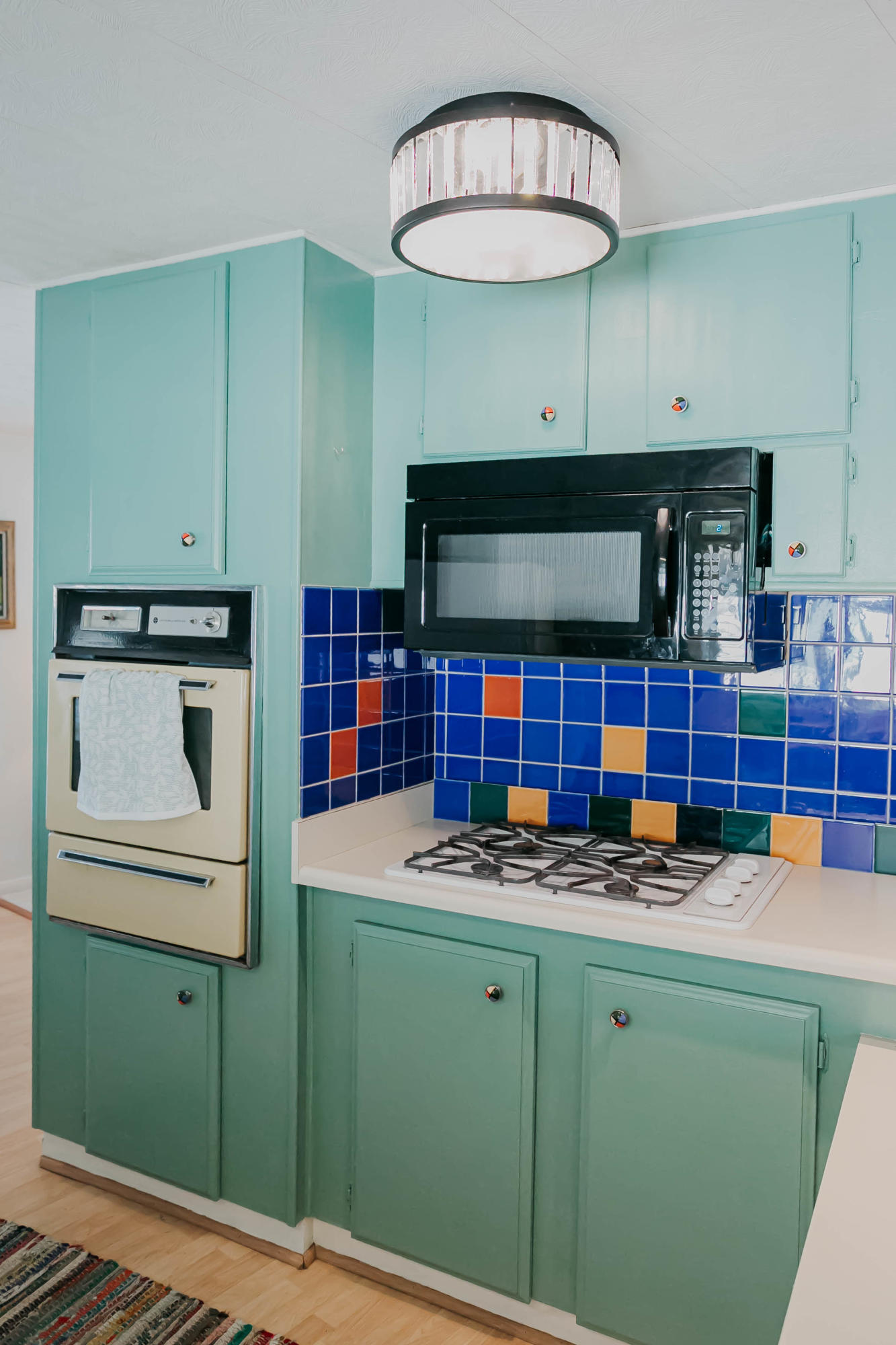 51555 Monroe Street, Unit 26 Indio, CA 92201 - Photo 23 of 54 a kitchen with lots of appliances cabinets and a table