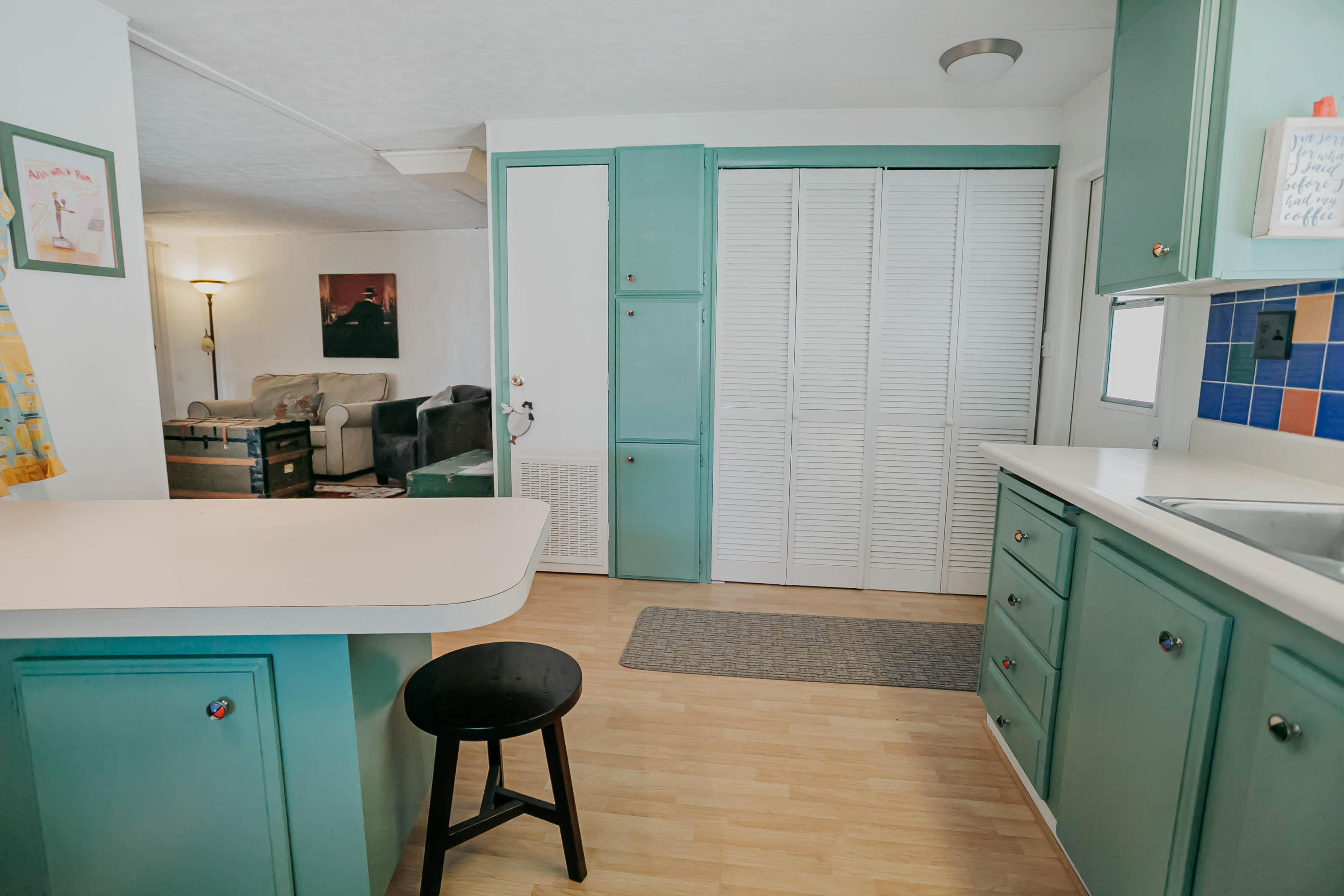 51555 Monroe Street, Unit 26 Indio, CA 92201 - Photo 24 of 54 a living room with furniture and a wooden floor