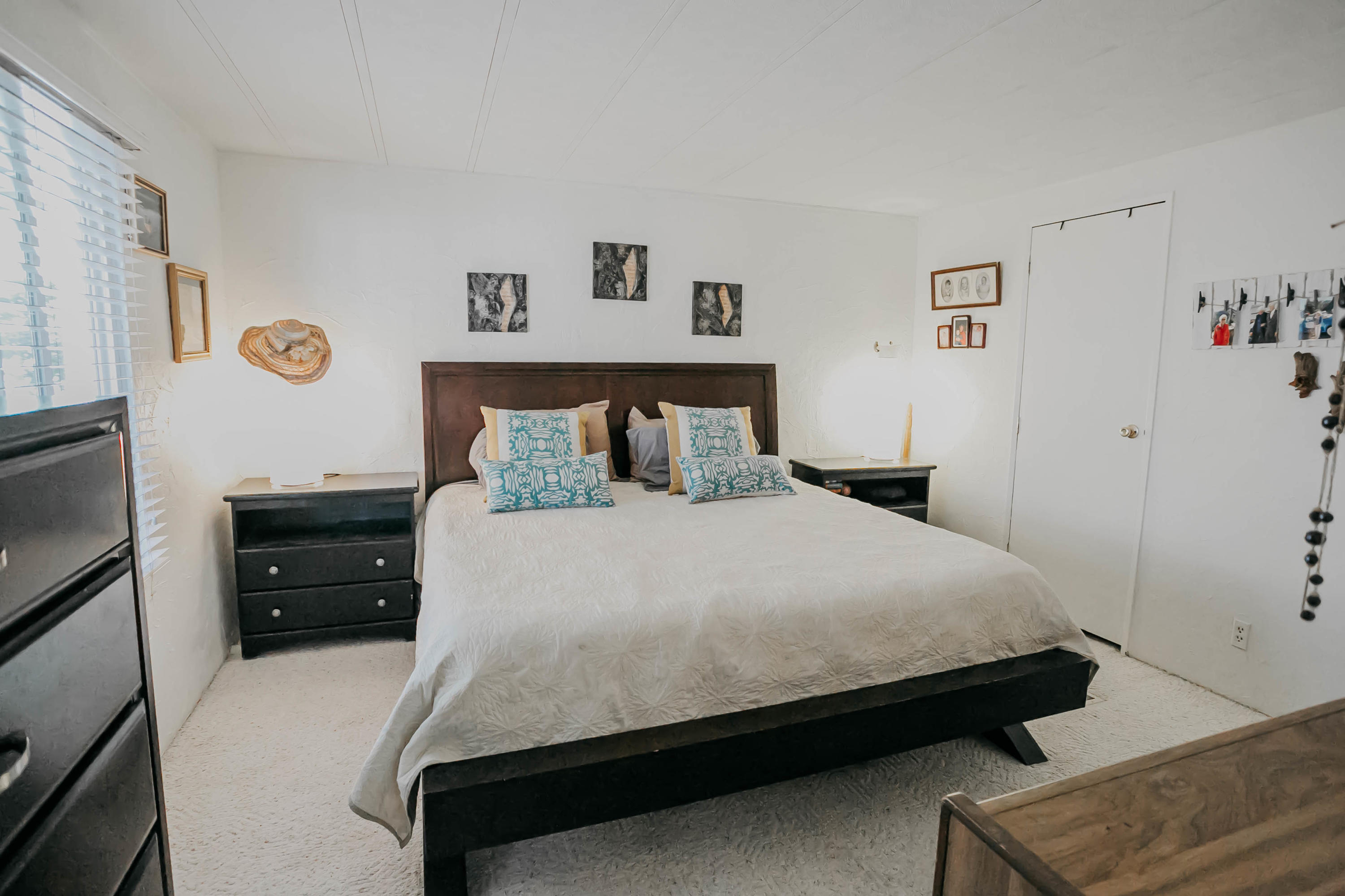51555 Monroe Street, Unit 26 Indio, CA 92201 - Photo 32 of 54 a bedroom with a bed and wooden floor