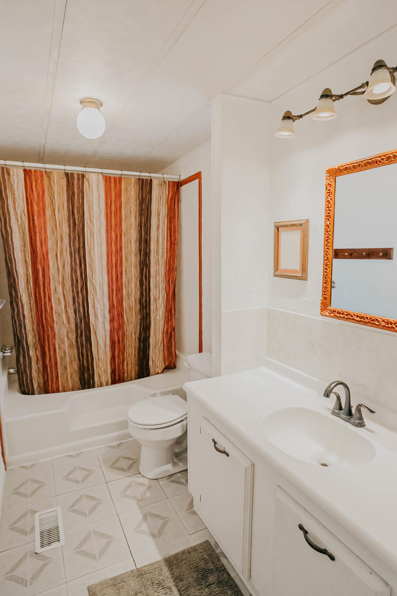 51555 Monroe Street, Unit 26 Indio, CA 92201 - Photo 35 of 54 a bathroom with a sink toilet and shower
