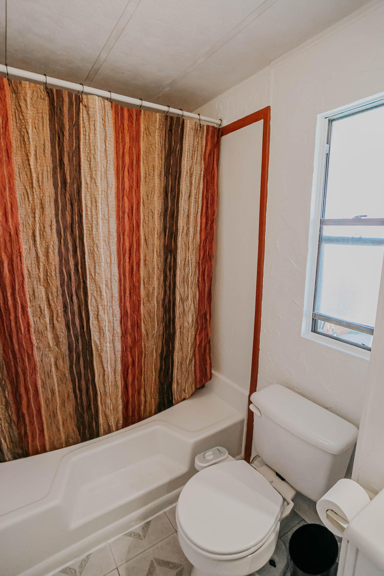 51555 Monroe Street, Unit 26 Indio, CA 92201 - Photo 38 of 54 a bathroom with a toilet and a shower