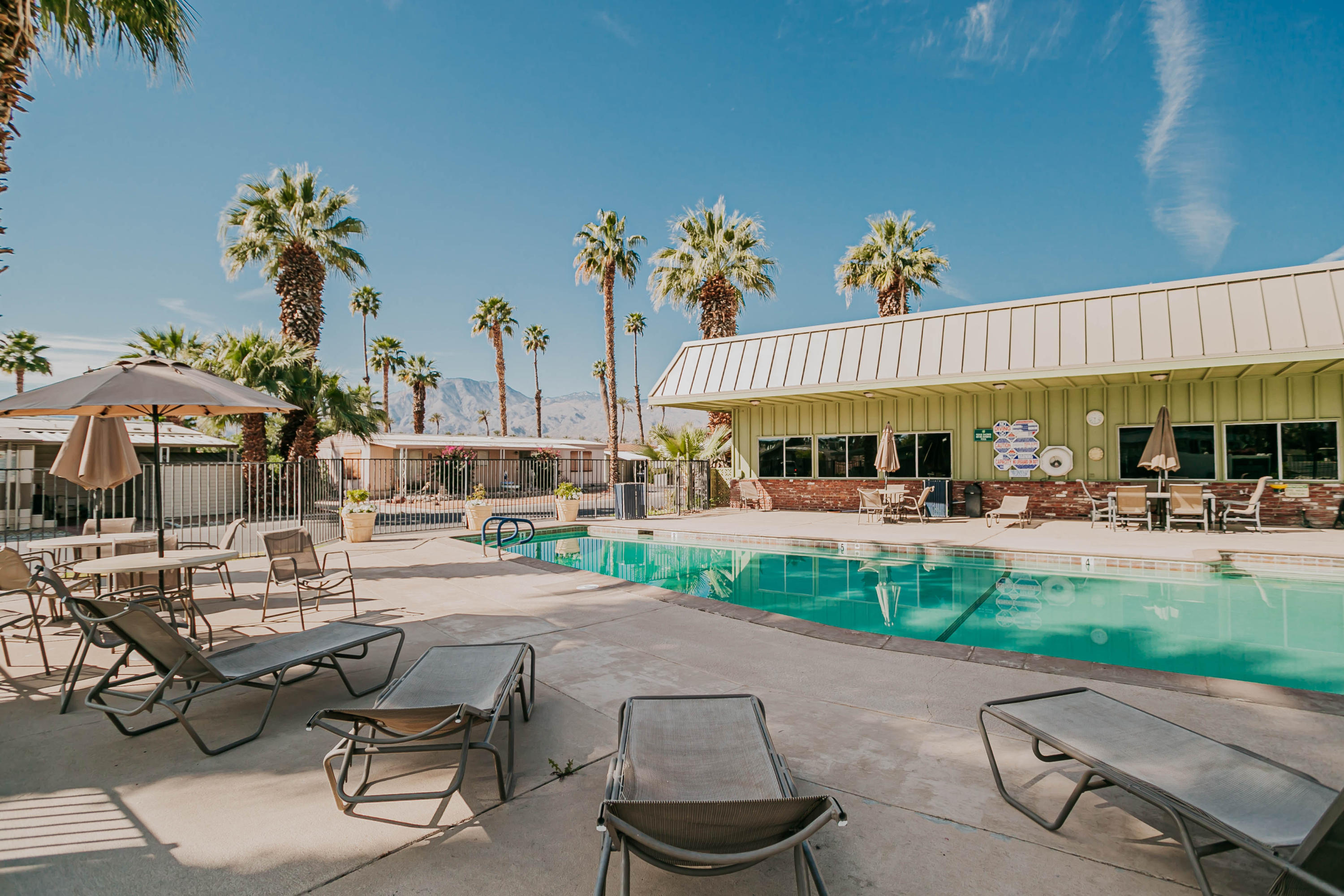 51555 Monroe Street, Unit 26 Indio, CA 92201 - Photo 51 of 54 a view of a swimming pool with outdoor seating