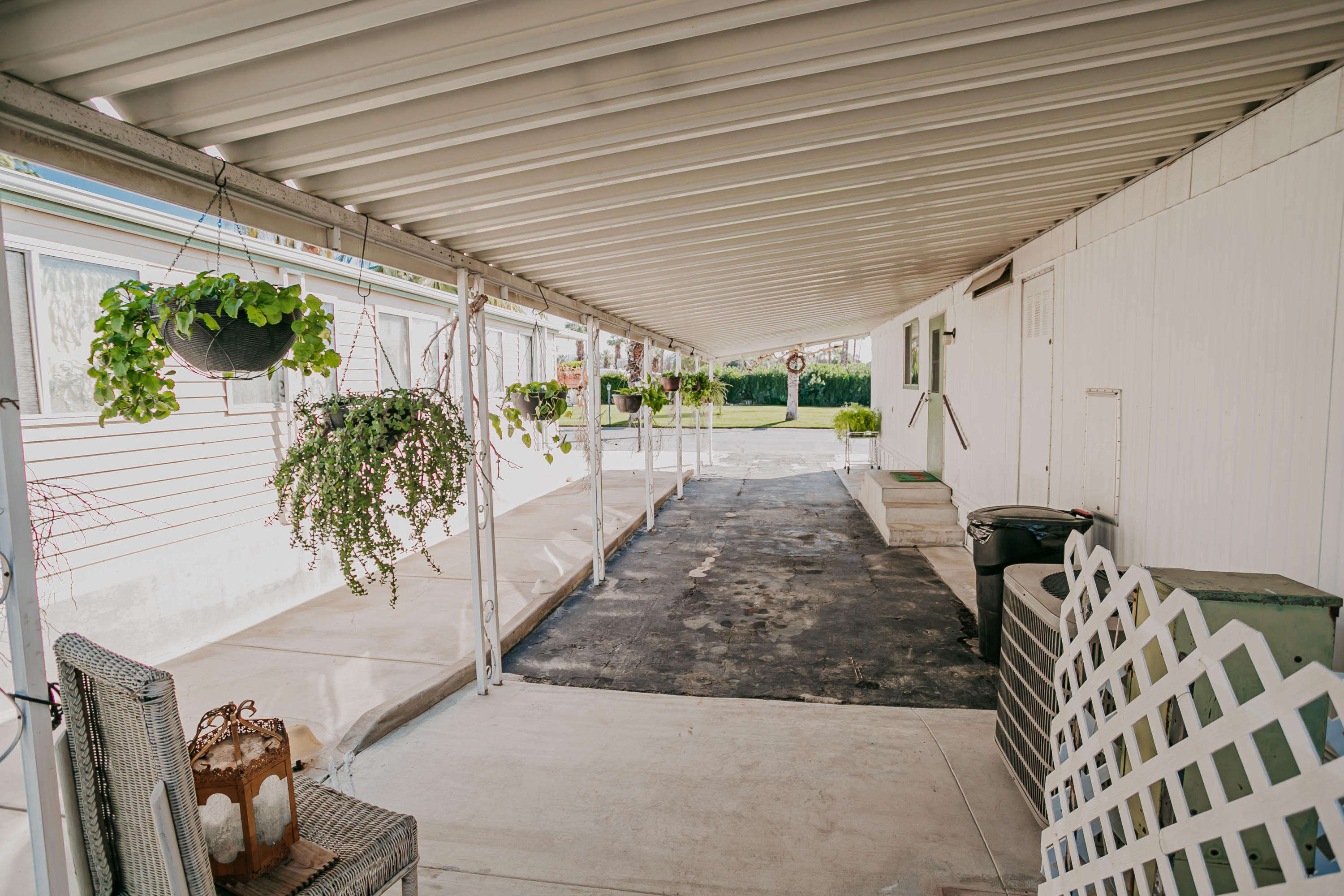51555 Monroe Street, Unit 26 Indio, CA 92201 - Photo 9 of 54 a living room with furniture and a potted plant