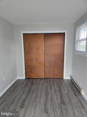 2204 Kirkwood Highway, Unit C Wilmington, DE 19805 - Photo 6 of 7 an empty room with wooden floor and closet