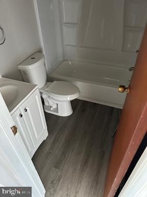 2204 Kirkwood Highway, Unit C Wilmington, DE 19805 - Photo 7 of 7 a bathroom with a toilet and a bathtub