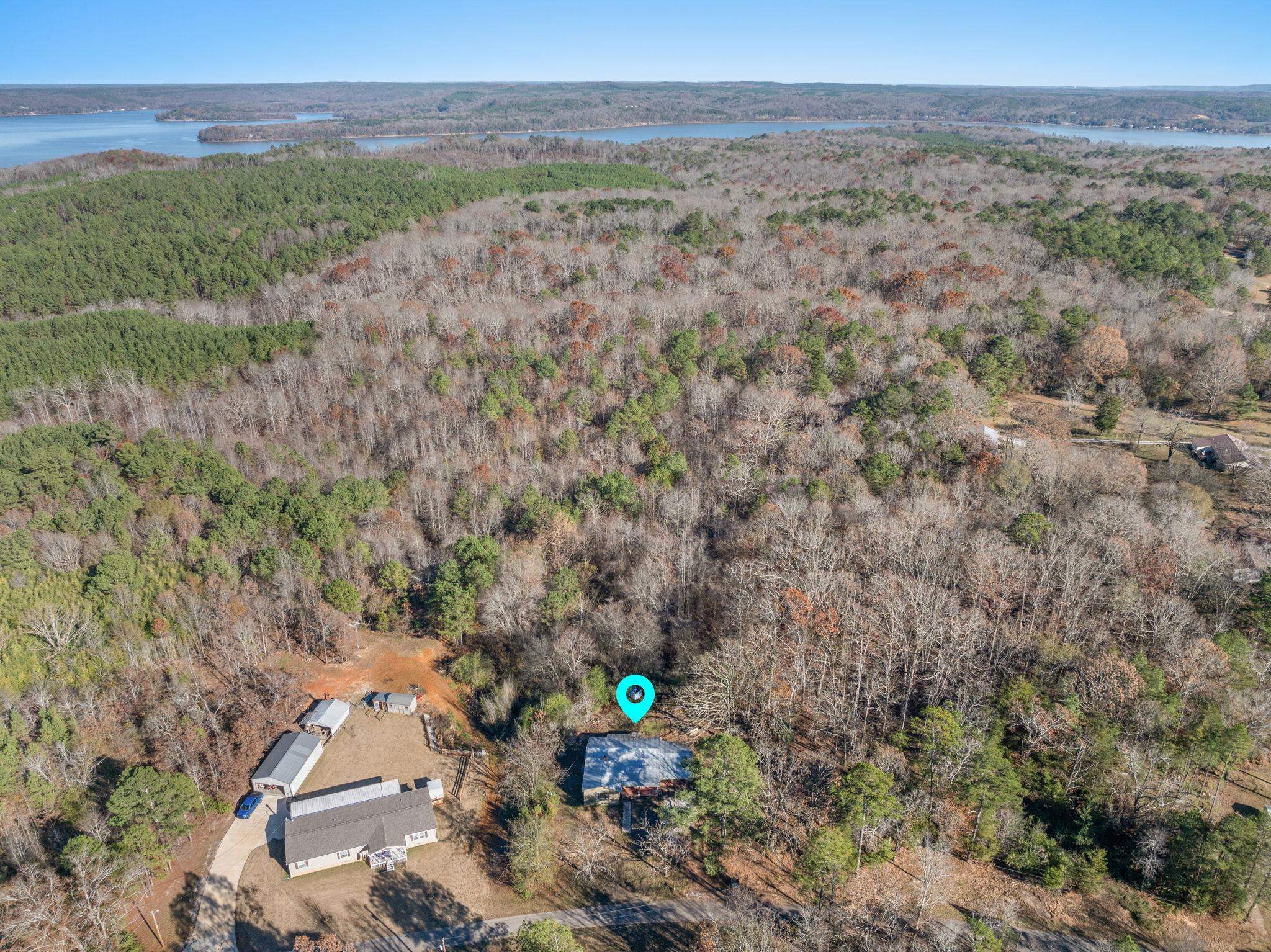 10 County Road 440 Iuka, MS 38852 - Photo 13 of 40 Aerial overview of property's location with a forest and a large body of water