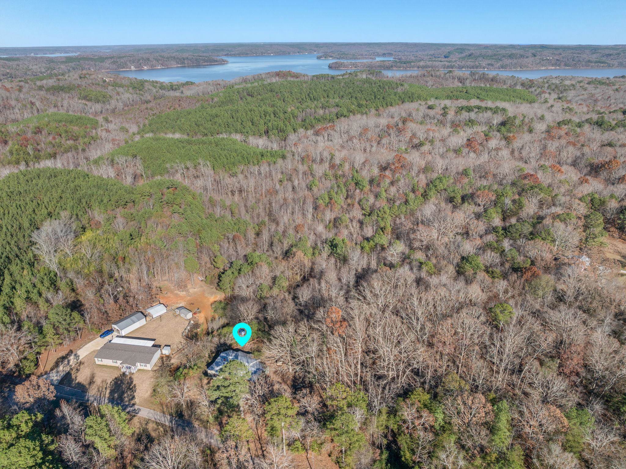 10 County Road 440 Iuka, MS 38852 - Photo 15 of 40 Aerial overview of property's location with a forest and a large body of water