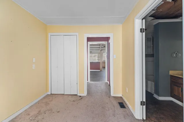 a room with a sink and a refrigerator