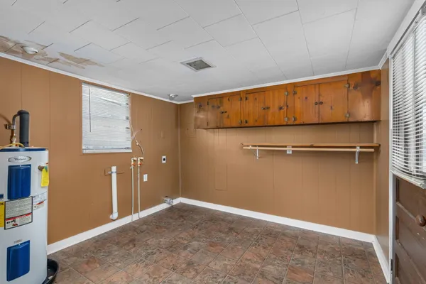 a view of an empty room with closet area