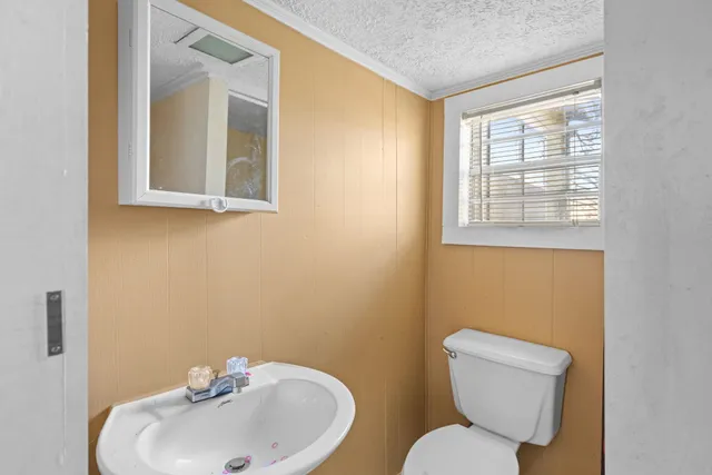 a view of a hallway with wooden floor and closet