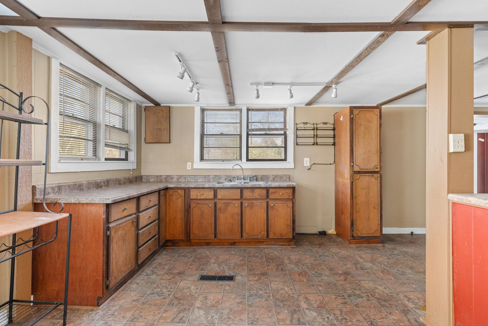 10 County Road 440 Iuka, MS 38852 - Photo 28 of 40 a spacious bathroom with a granite countertop sink and a mirror
