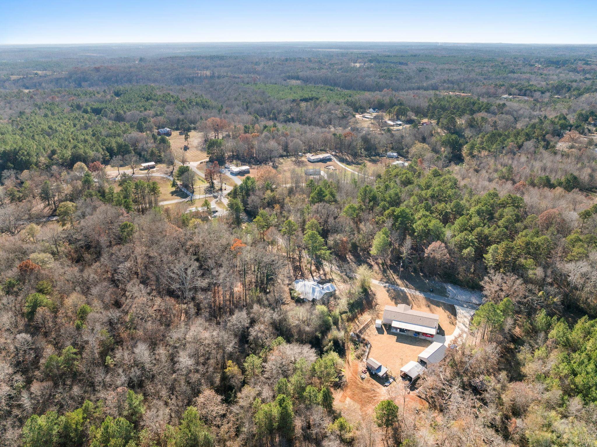 10 County Road 440 Iuka, MS 38852 - Photo 38 of 40 an aerial view of house with yard and mountain view in back