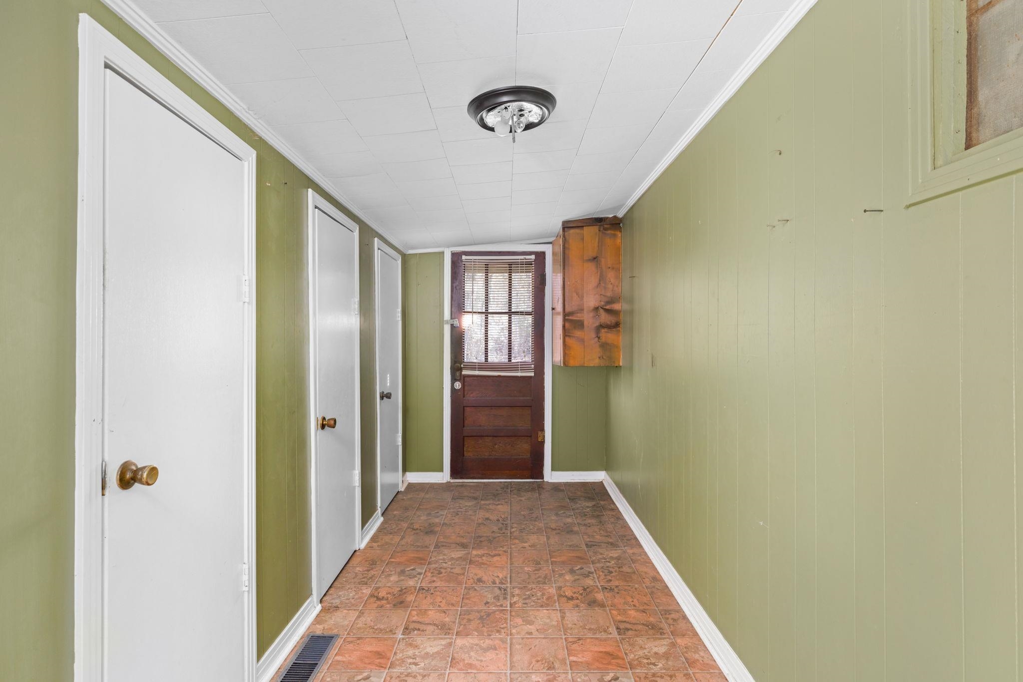 10 County Road 440 Iuka, MS 38852 - Photo 10 of 40 a view of a hallway with wooden floor and closet