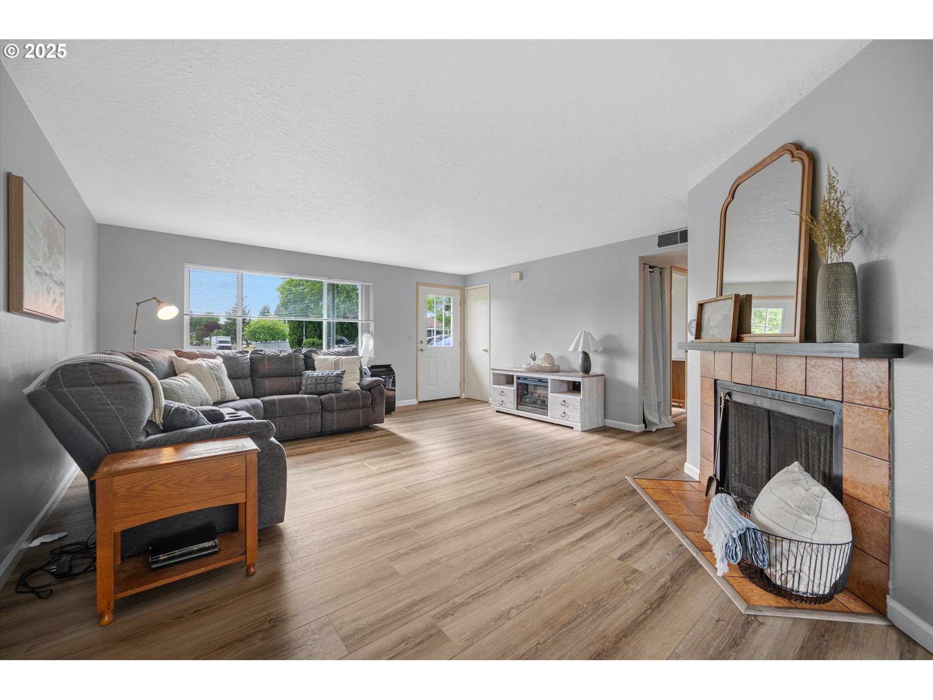 4591 Juliana Loop Southeast Salem, OR 97317 - Photo 11 of 32 a living room with furniture and a fireplace