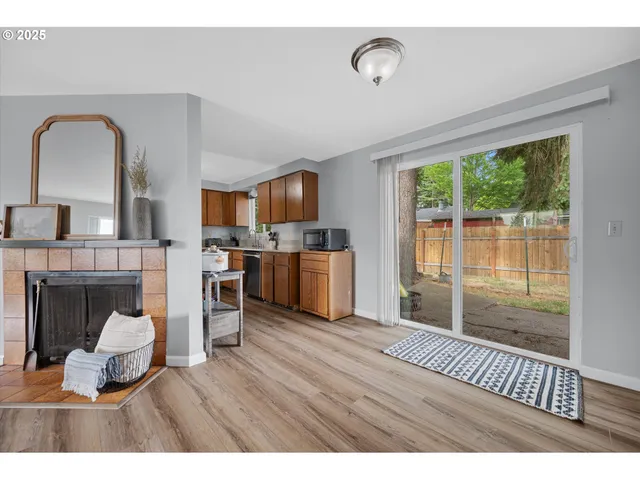 a kitchen with stainless steel appliances granite countertop a sink a stove and a refrigerator