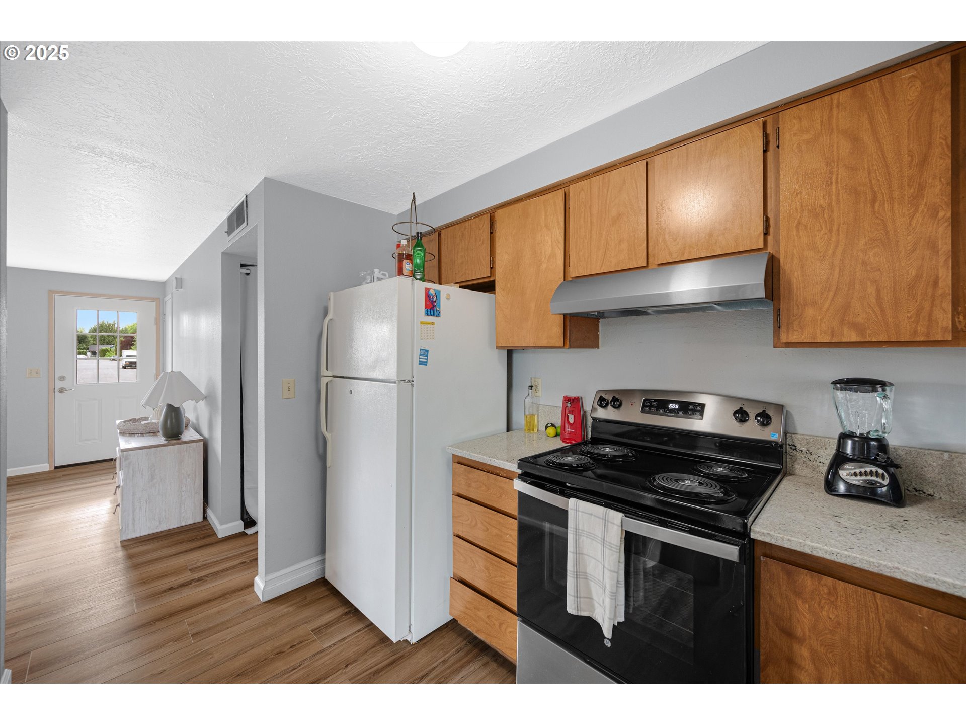 4591 Juliana Loop Southeast Salem, OR 97317 - Photo 16 of 32 a kitchen with a refrigerator and a stove top oven