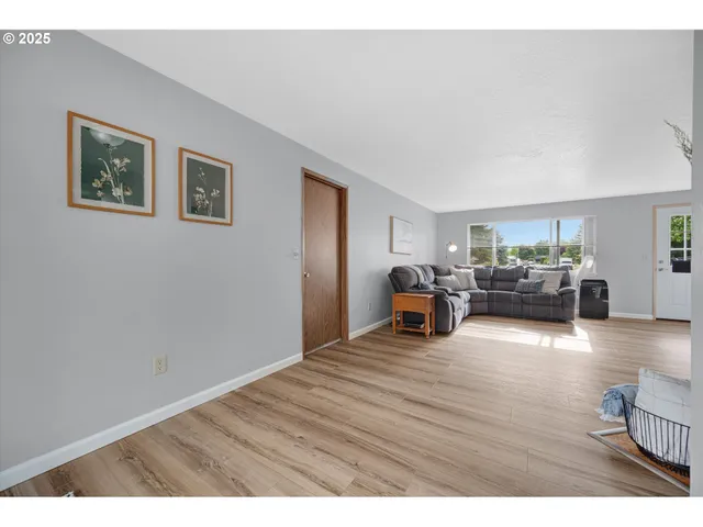 a bathroom with a sink a toilet a mirror and shower curtain