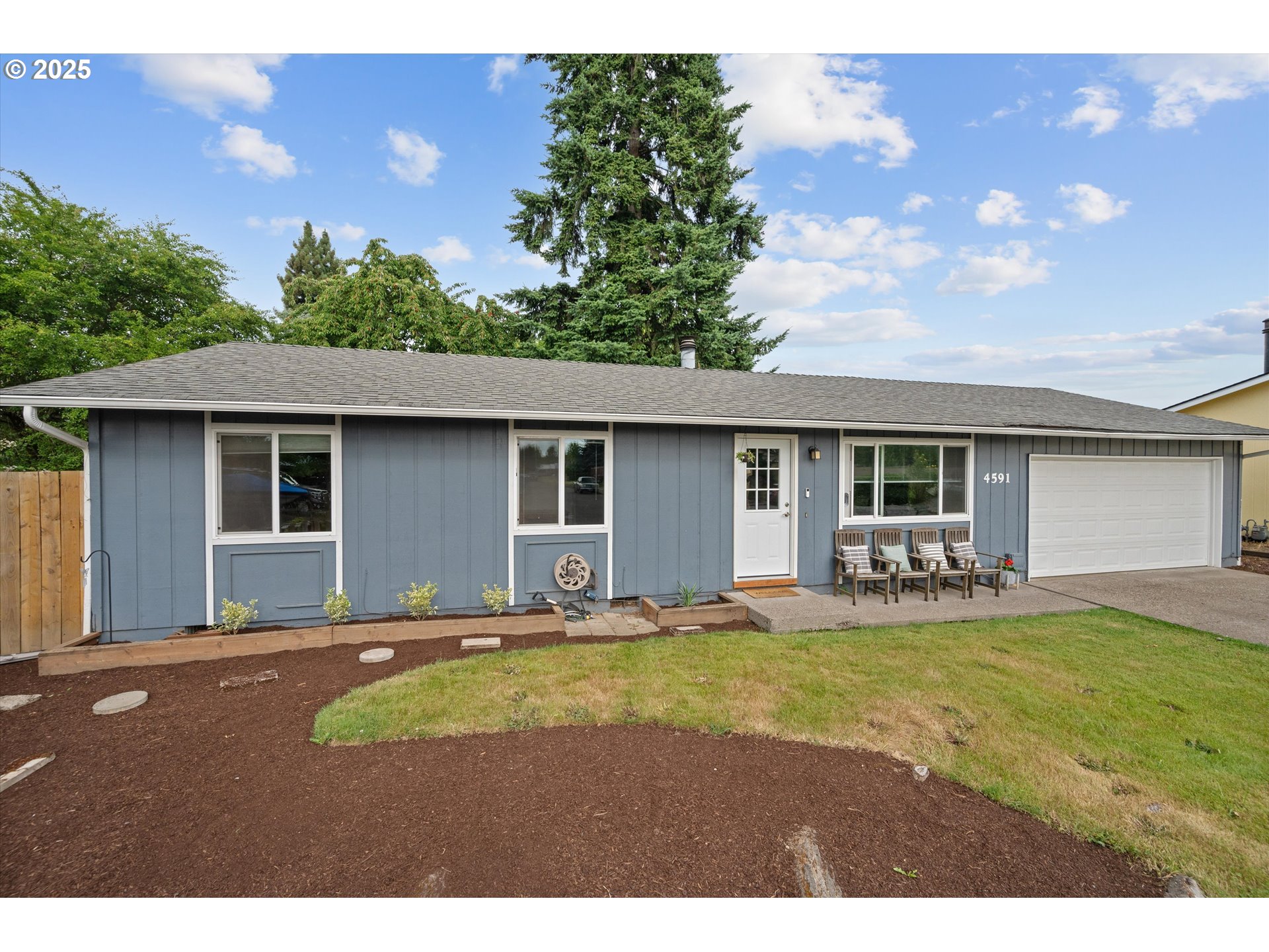 4591 Juliana Loop Southeast Salem, OR 97317 - Photo 2 of 32 a front view of a house with a garden and yard