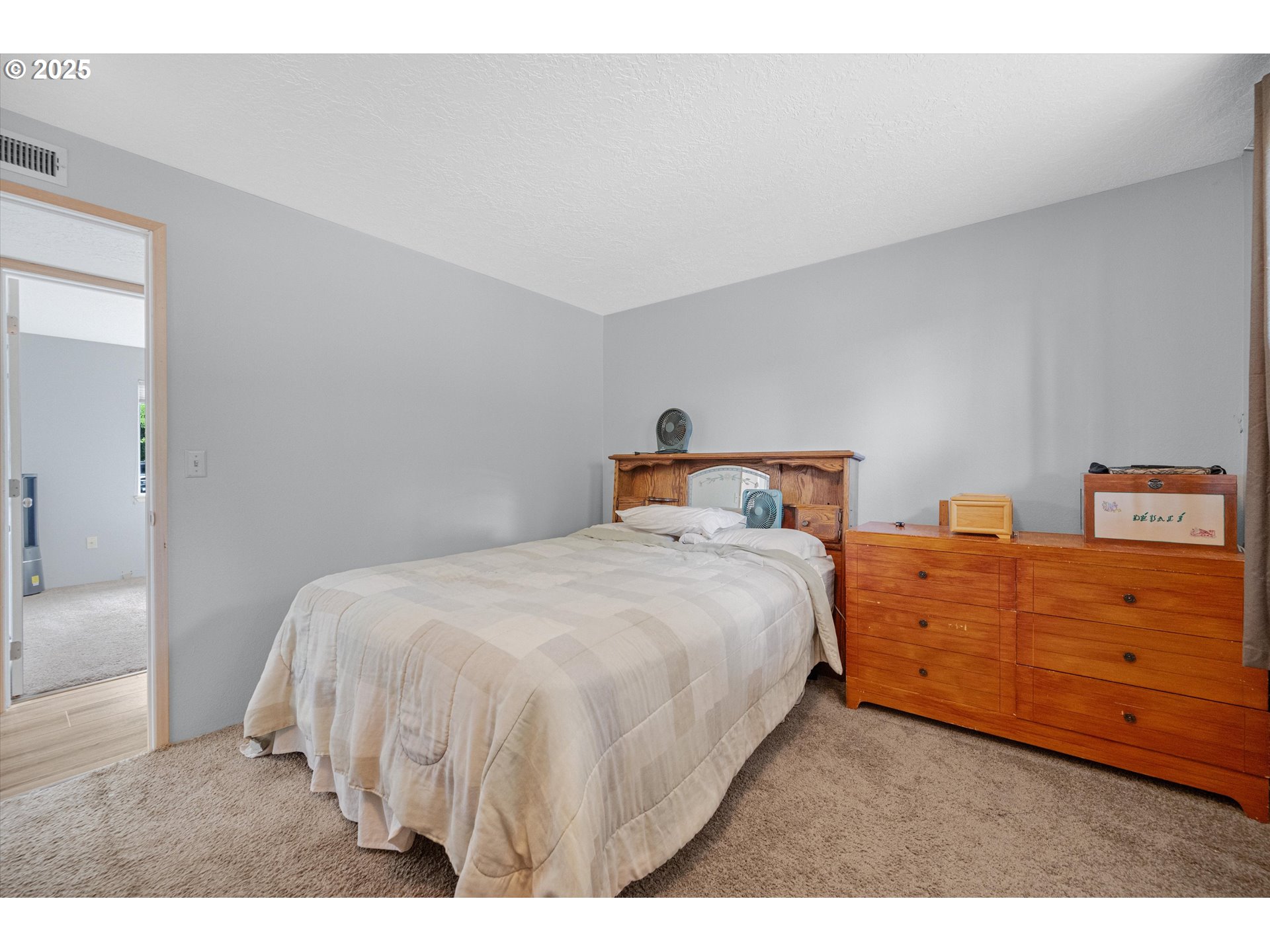 4591 Juliana Loop Southeast Salem, OR 97317 - Photo 21 of 32 a bedroom with a bed and a dresser
