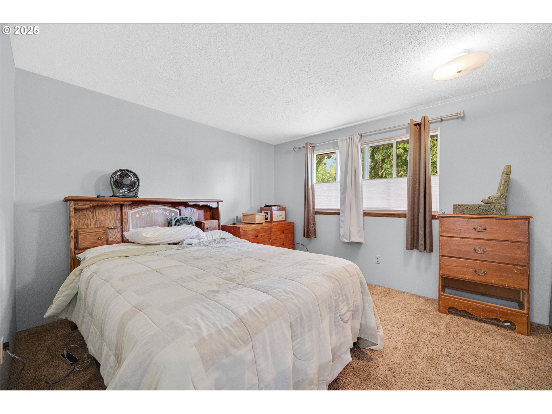 4591 Juliana Loop Southeast Salem, OR 97317 - Photo 22 of 32 a bedroom with a bed and a dresser