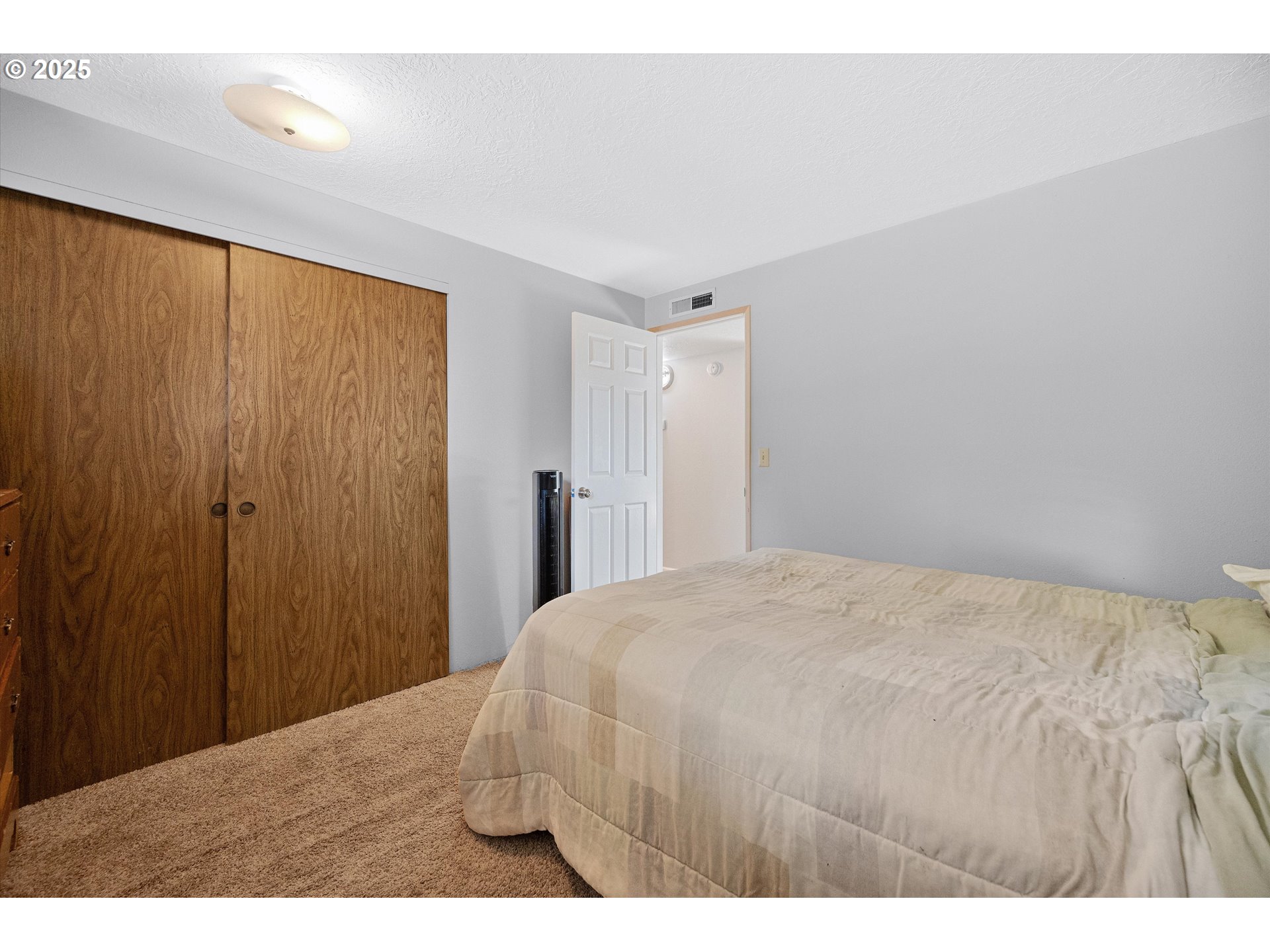 4591 Juliana Loop Southeast Salem, OR 97317 - Photo 23 of 32 a bedroom with a bed and a table