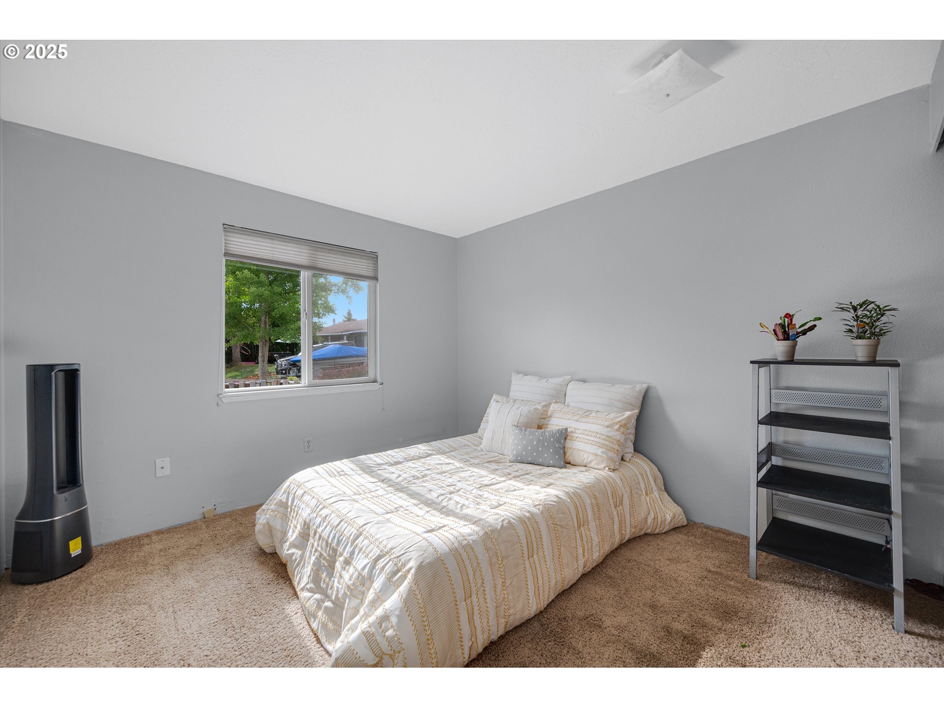 4591 Juliana Loop Southeast Salem, OR 97317 - Photo 24 of 32 a bedroom with a bed and a window