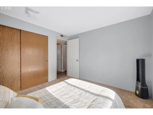 a view of a house with a yard and tree