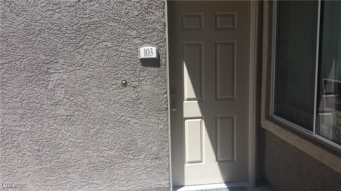 3411 Cactus Mountain Street, Unit 103 Las Vegas, NV 89129 - Photo 1 of 20 Property entrance with stucco siding