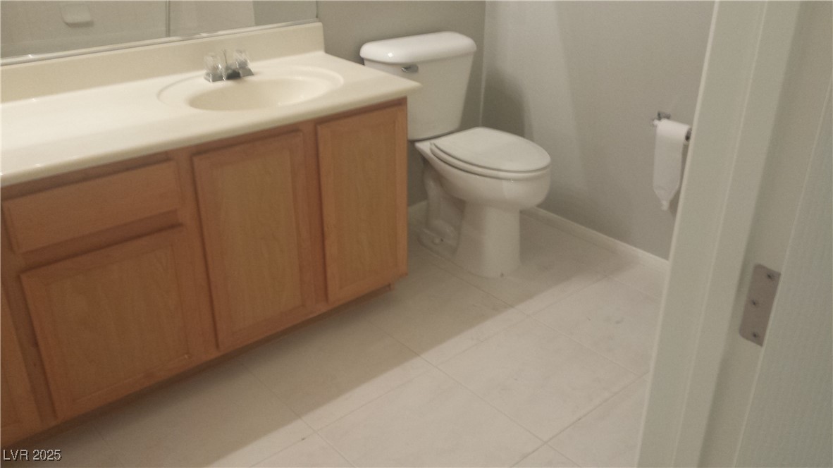 3411 Cactus Mountain Street, Unit 103 Las Vegas, NV 89129 - Photo 2 of 20 Bathroom featuring vanity and light tile patterned flooring