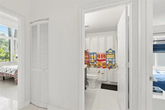 a children room with toys and a window