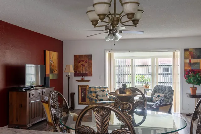 a view of a livingroom with furniture window and hardwood floor