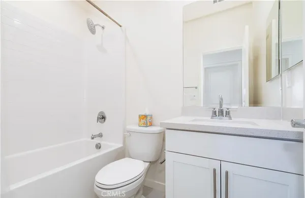 a view of a hallway with washer and dryer