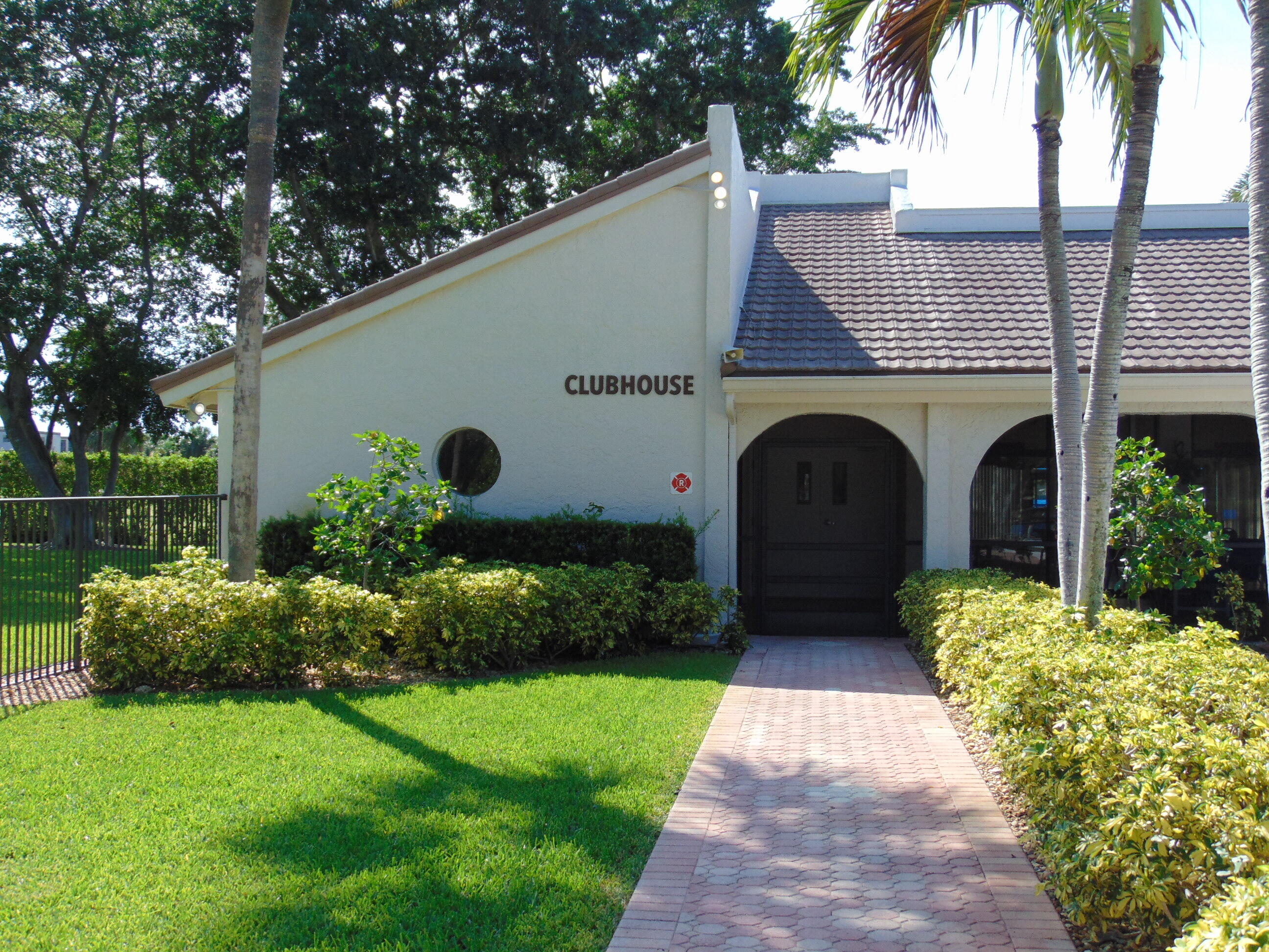 9220 Southwest 14th Street, Unit 3103 Boca Raton, FL 33428 - Photo 43 of 58 a front view of a house with garden